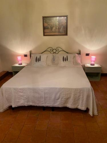 Ліжко або ліжка в номері Casa del Capitano Rocca d'Orcia