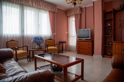 TV a/nebo společenská místnost v ubytování Pico da Costa