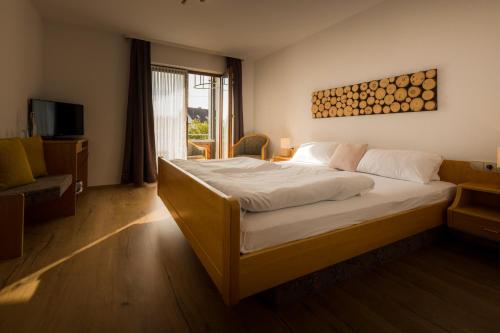 En eller flere senge i et værelse på Landgasthof Ritter