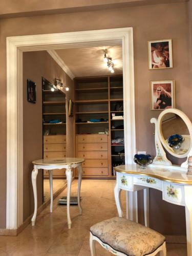 a dining room with a table and a closet at Villa Natalia in Ayia Napa