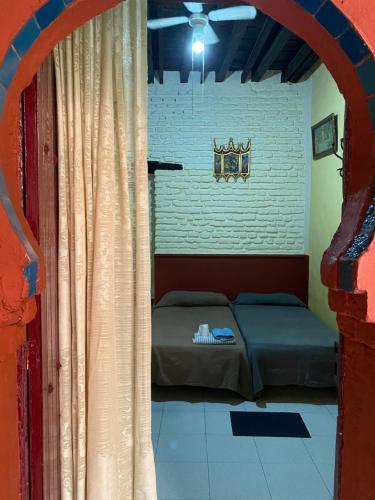 a room with a bed and a window at PENSION VERGARA , Sevilla in Seville