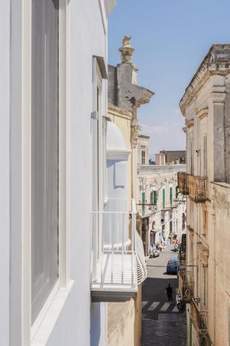 a view of a street from a window of a building at Le Volte Procida Home in Procida
