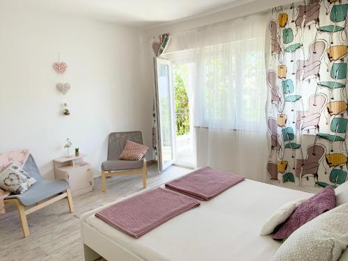 Posteľ alebo postele v izbe v ubytovaní Apartment GardenView - New!