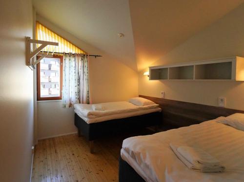 Cama ou camas em um quarto em Zone Apartments