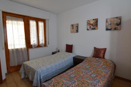 En eller flere senger på et rom på casa vacanze I GIRASOLI