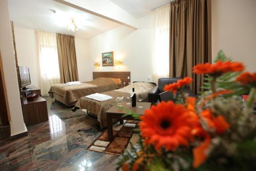 Ένα ή περισσότερα κρεβάτια σε δωμάτιο στο Hotel Kratis