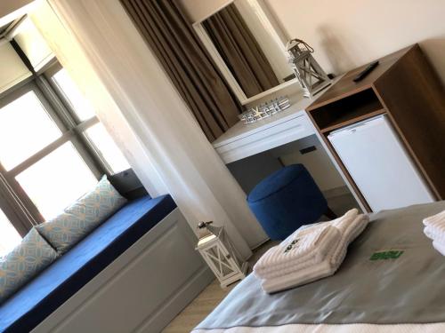Ένα ή περισσότερα κρεβάτια σε δωμάτιο στο Neva Hotel Alaçatı