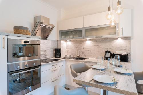Kuchyň nebo kuchyňský kout v ubytování Residenz Seestern