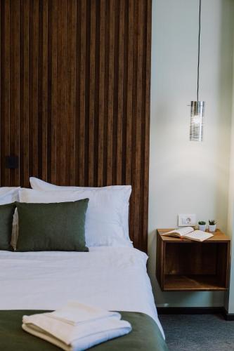 Un ou plusieurs lits dans un hébergement de l'établissement Hotel Kapri