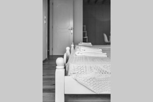 a bedroom with a white bed with white sheets at Spiti Maria in Valaneíon