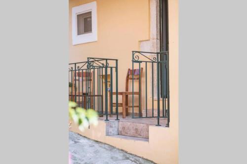 a set of wrought iron railings on a building at Spiti Maria in Valaneíon
