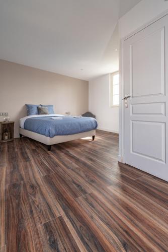 Ένα ή περισσότερα κρεβάτια σε δωμάτιο στο L'Auberge du Croissant