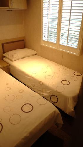 Een bed of bedden in een kamer bij The Ashcroft