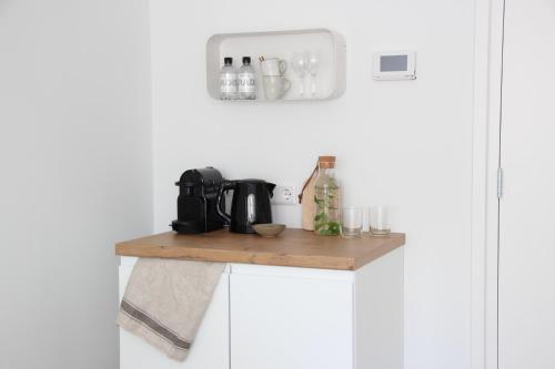 
a white counter top with a white towel on top of it at Hotel Paradis in Zandvoort
