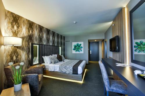 เตียงในห้องที่ Hotel Anatolia