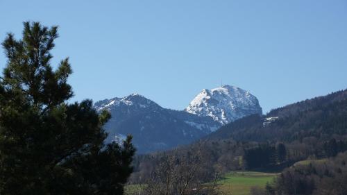 a mountain range with snow capped mountains in the distance at Gästehaus Funk in Bad Feilnbach