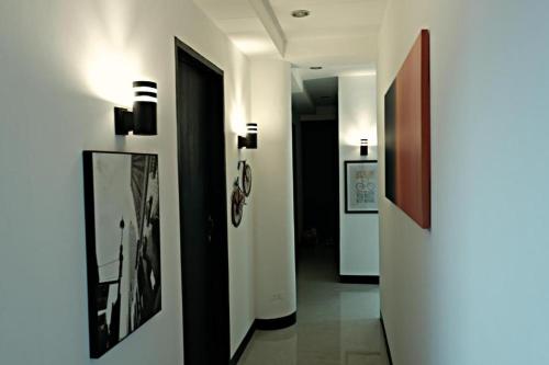 a hallway with pictures on the walls of a building at Mactan District Budgetel - Lapu Lapu Cebu in Mactan