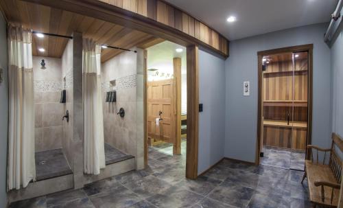 a bathroom with a shower and a walk in shower at Golden Arrow Lakeside Resort in Lake Placid