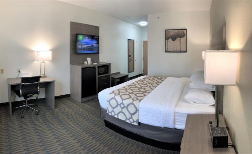 Ένα ή περισσότερα κρεβάτια σε δωμάτιο στο Baymont by Wyndham Paw Paw