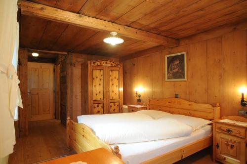 Postel nebo postele na pokoji v ubytování Glinzhof Mountain Natur Resort Agriturismo