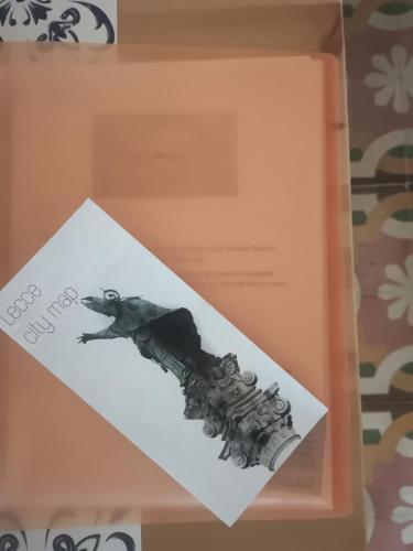 an envelope with a drawing of a gun in a box at Eccelsoleccese Boutique B&B - steps from the Historic Center in Lecce