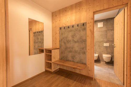 a bathroom with a shower and a toilet at Apt Mirko - Haus Kostner in Santa Cristina in Val Gardena