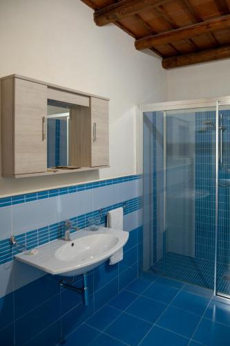 a bathroom with a sink and a shower at Fardella 250 in Trapani