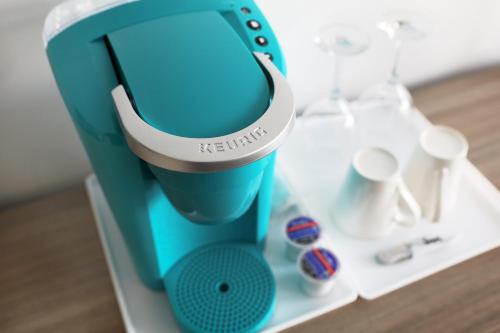a blue and white mixer sitting on a table at Hotel Plante in Gaspé