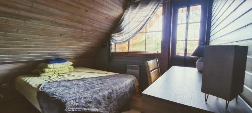 Ένα ή περισσότερα κρεβάτια σε δωμάτιο στο Lombi Holiday House