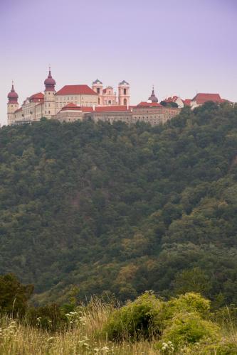 a large building on top of a hill at Gästehaus Benediktinerstift Göttweig - Bed & Breakfast Monastery in Furth