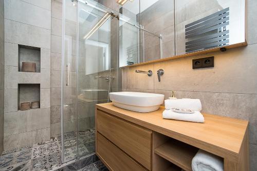 a bathroom with a sink and a shower at Charming apartment in famous area in Prague