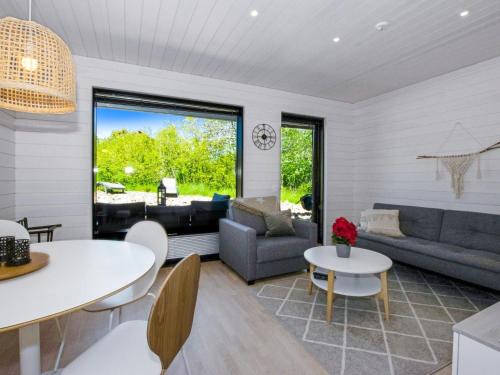 a living room with a couch and a table at Holiday Home Kasnäs marina b12 by Interhome in Kasnäs