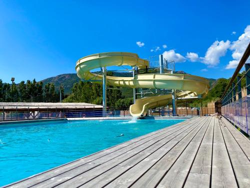 a water slide in a swimming pool at Camping Le Sagone in Sagone