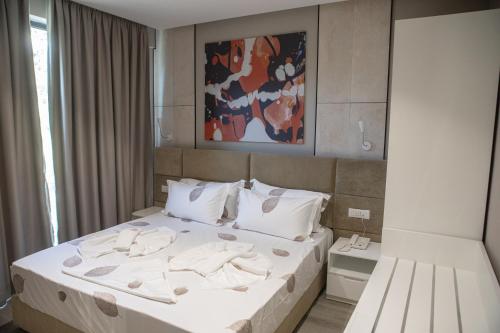 מיטה או מיטות בחדר ב-Hotel Qeparo