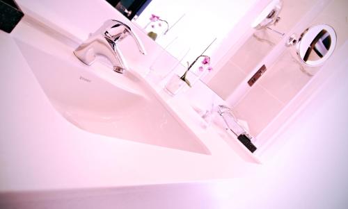 a bathroom with two sinks and a mirror at Hampton Hotel in Dublin