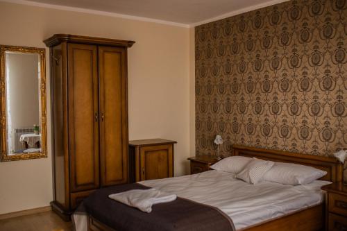 Postel nebo postele na pokoji v ubytování Hotel Przedzamcze