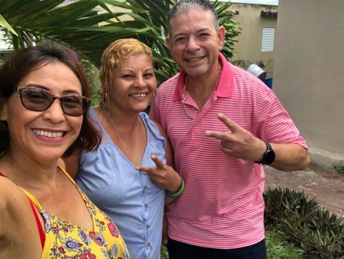 a man and two women posing for a picture at Gavidias Guest House in San Lorenzo