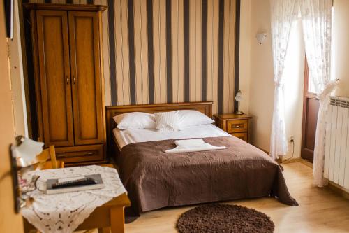Postel nebo postele na pokoji v ubytování Hotel Przedzamcze