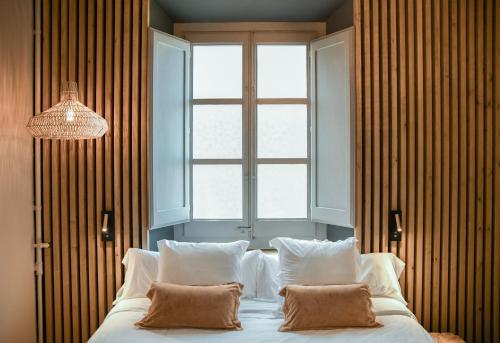 Postel nebo postele na pokoji v ubytování Hotel Aiguaclara