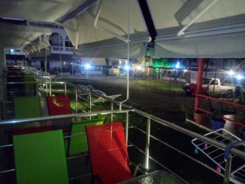 a farm at night with lights in a field at Persefoni Rooms Apartments & Mezonetes in Toroni
