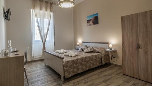 Postel nebo postele na pokoji v ubytování BOSS Guest House