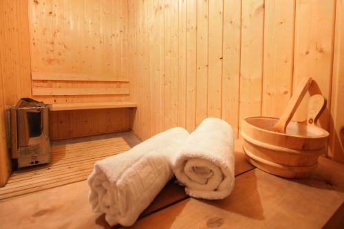 a bathroom with a towel in a wooden room at Szekla in Stronie Śląskie