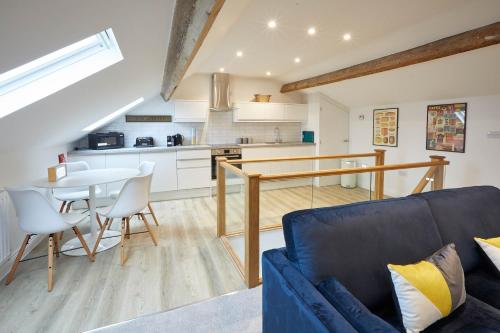 a kitchen and living room with a couch and a table at Host & Stay - Cornerhouse Apartments in Saltburn-by-the-Sea
