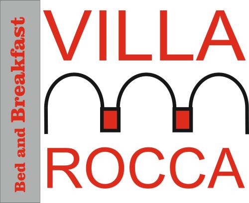 ein Schild für ein veganes Restaurant mit dem textvegan rocca in der Unterkunft Villa Rocca Leivi in Leivi