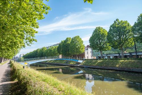 a bridge over a river in a city at Fred&Breakfast in Ghent