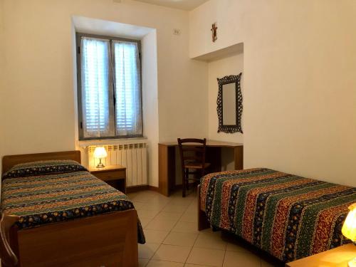 Posteľ alebo postele v izbe v ubytovaní Residenza Pitigliano Gens Petilia - Nuova gestione