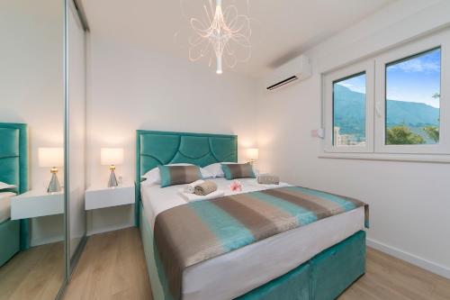 Posteľ alebo postele v izbe v ubytovaní Apartman Blue Paradise