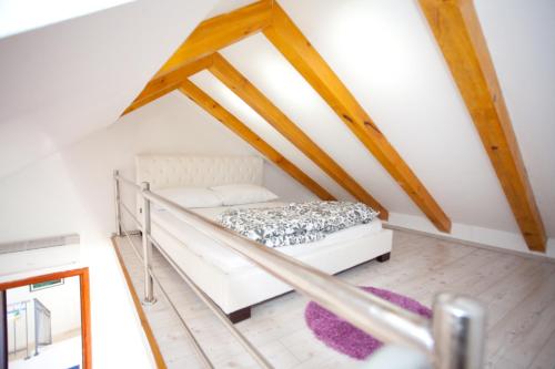 a bedroom with a bed in a attic at F&F Apartments in Split