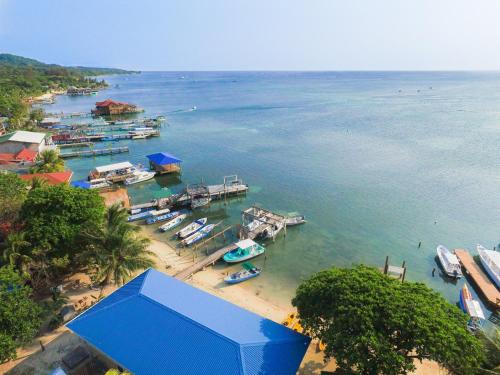 a group of boats docked at a dock in the water at Bella Luna Beach Home #226859 in West End