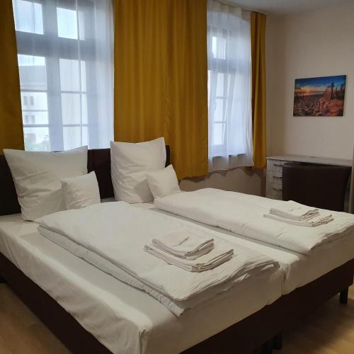 Ένα ή περισσότερα κρεβάτια σε δωμάτιο στο Apartments Oberschlesien